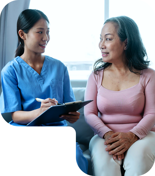 A woman looking at an elderly woman